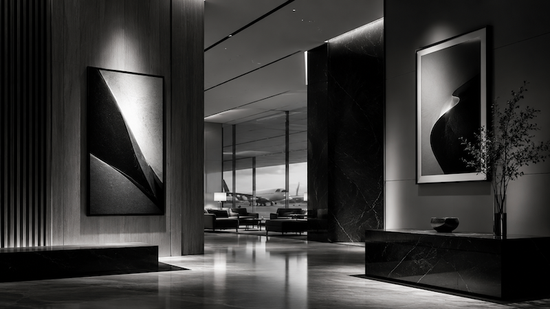 Monochrome abstract image of a refined luxury interior space with subtle media placement, representing premium out-of-home advertising and physical brand presence